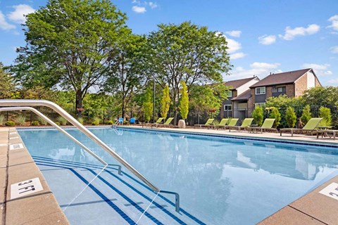 Resort-style heated swimming pool with sundeck at Ridgewood Apartments in Grand Rapids, MI