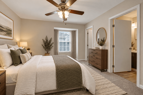 Apartment bedroom with spacious layout and ceiling fan at Canterbury Apartments in Myrtle Beach, SC