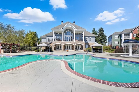 Resort-style swimming pool with apartment community views at The Glen at Alexander in Augusta, GA