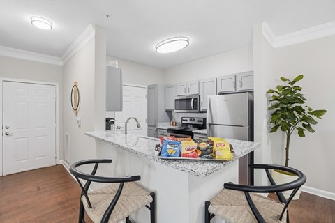 Open apartment kitchen and dining area at The Glen at Alexander in Augusta, GA