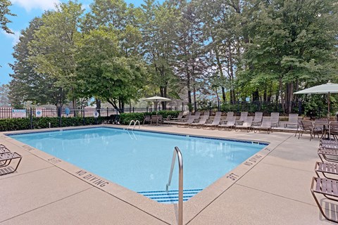 Resort-style swimming pool with sundeck at Timber Ridge Apartments in Wyoming, MI