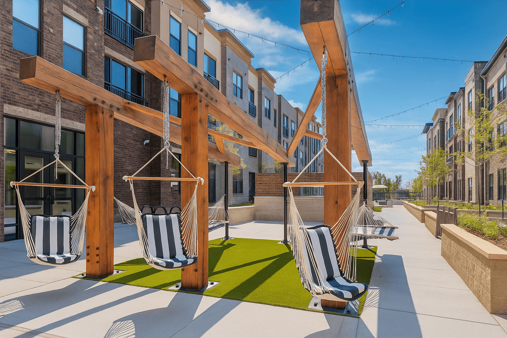 A wooden pergola with hanging chairs is in front of a building.
