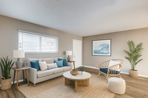 A living room with a white couch, a wooden coffee table, and a painting on the wall.