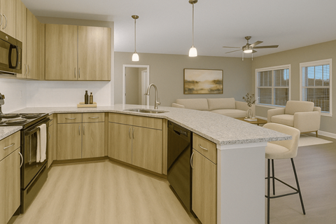 A kitchen with wooden cabinets and a marble countertop.