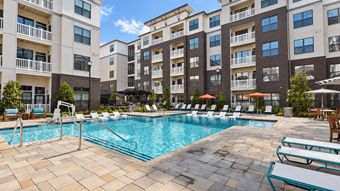 Swimming pool with entry steps, handrails, sun-shelf loungers and poolside seating at Argento at Sugarloaf.