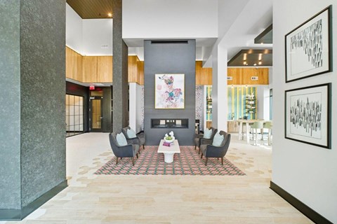 A modern living room with a grey sofa set and a coffee table.
