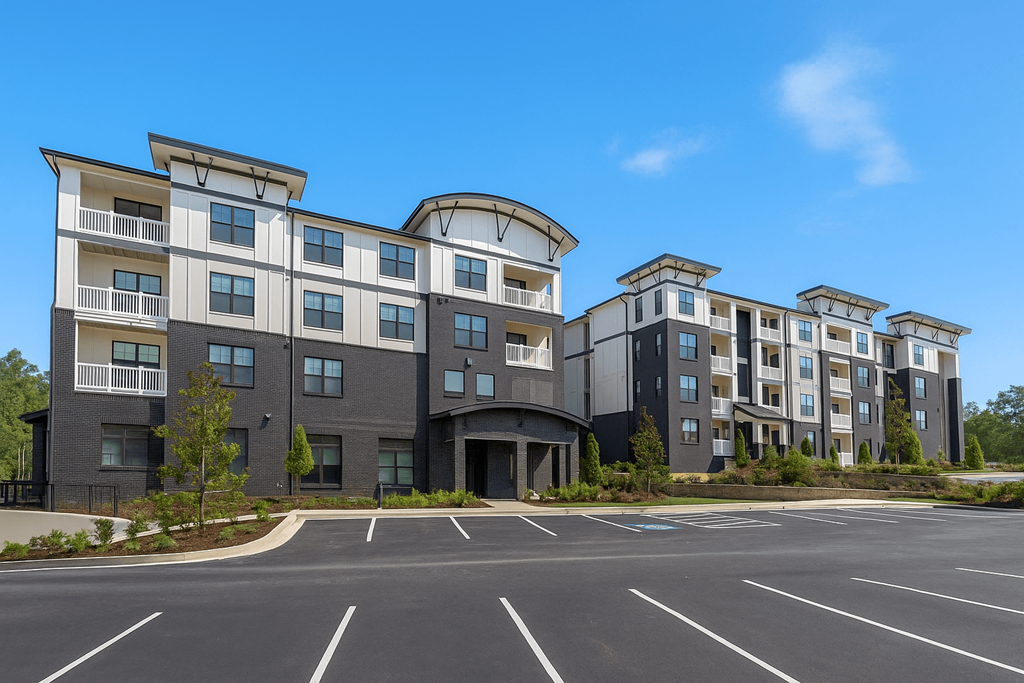 A large building with a parking lot in front of it.