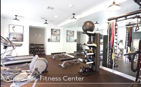 A fitness center with a variety of equipment.