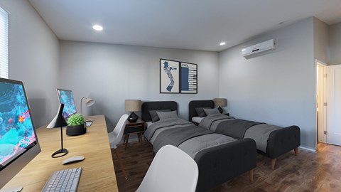 A modern bedroom with a large bed and a desk with a computer.
