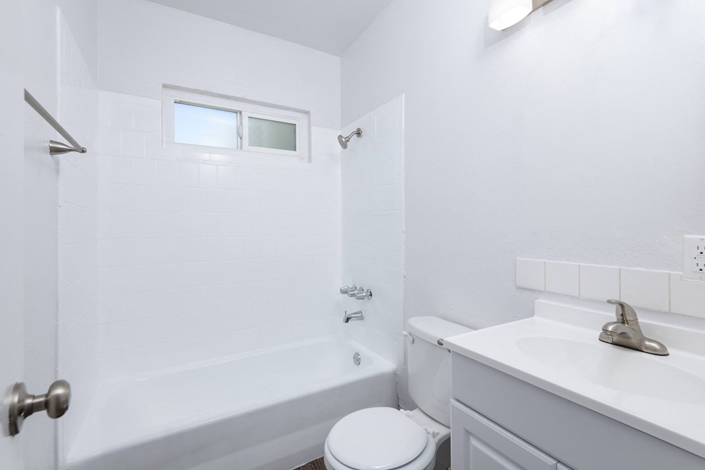 a bathroom with a sink toilet and bathtub