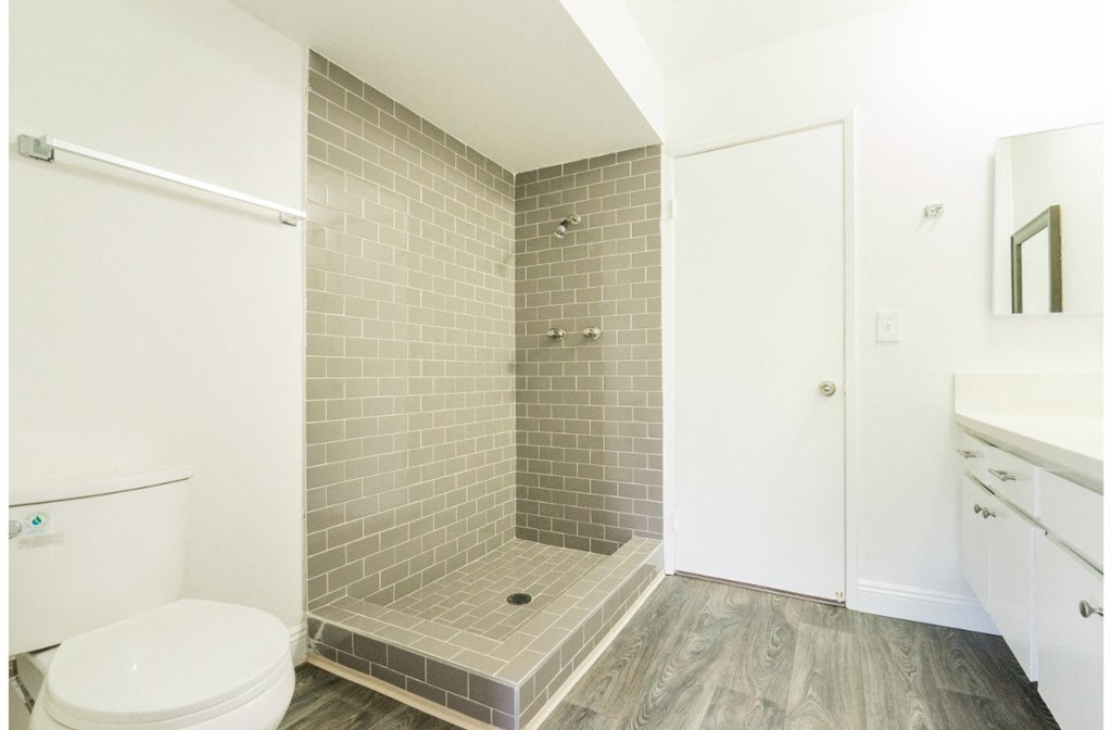 a small bathroom with a toilet and a shower