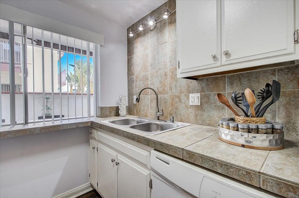 a kitchen with a sink and a window