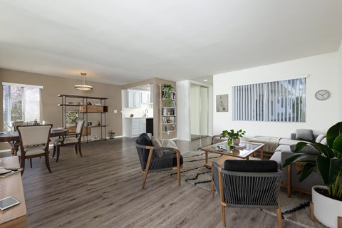 A living room with a grey sofa and a wooden coffee table.