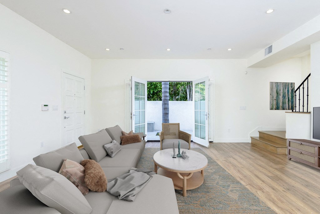 a living room with a gray couch and a coffee table