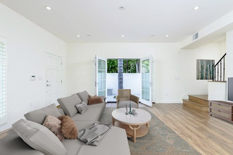 a living room with a gray couch and a coffee table