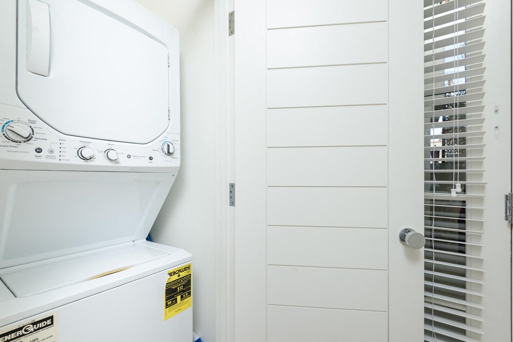 a white washer and dryer in a laundry room