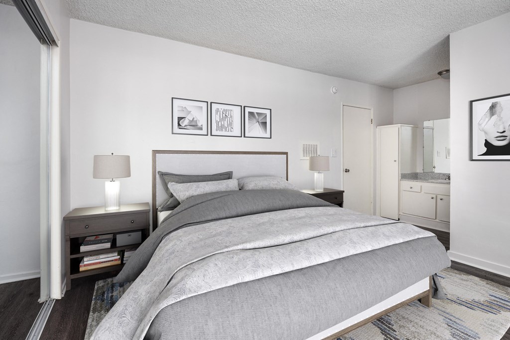 a bedroom with a bed and a nightstand