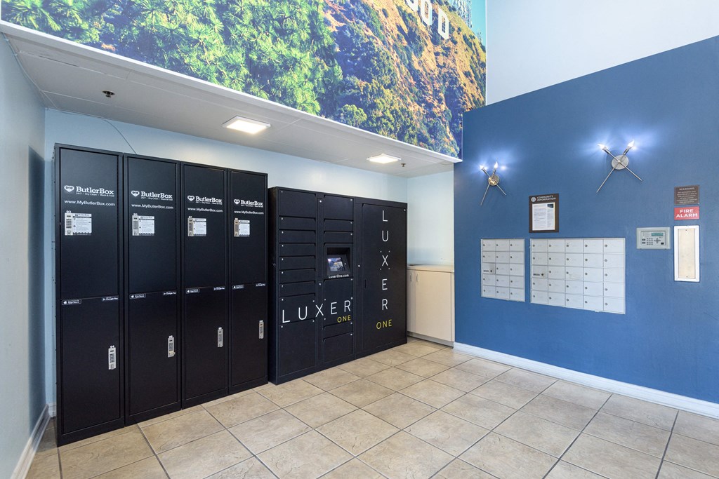 a wall of lockers with a large mural on top of it