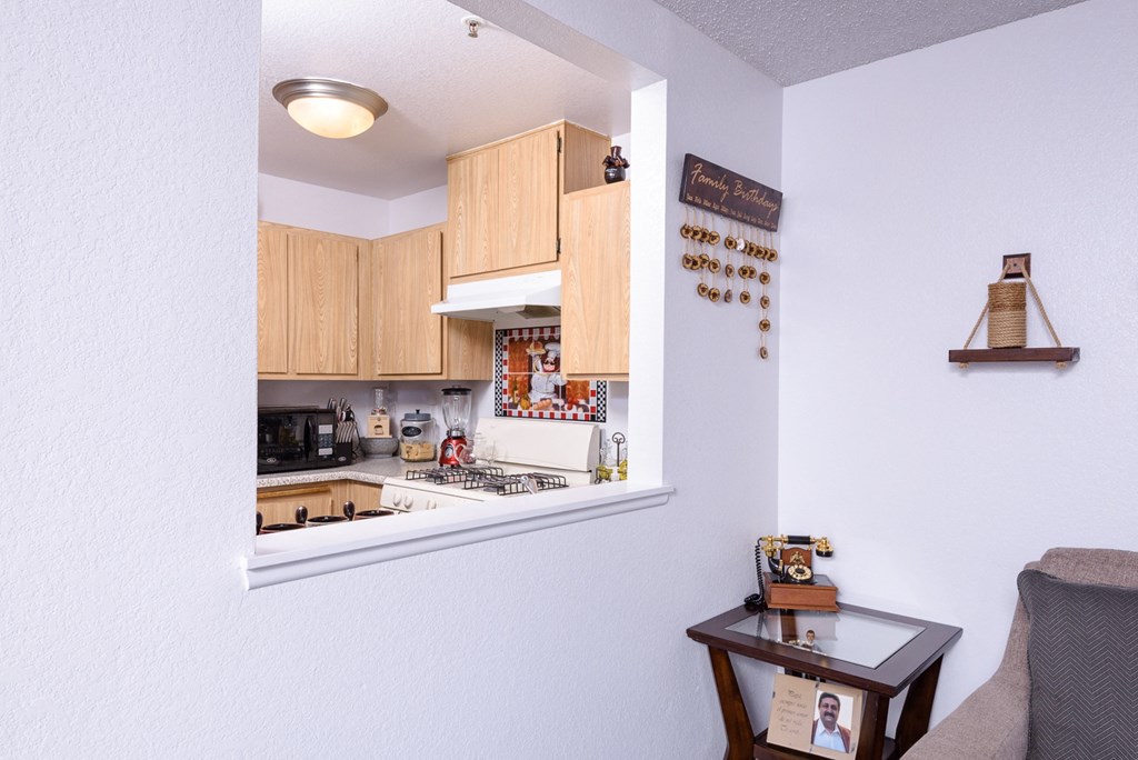 a view of a kitchen from a window in a living room