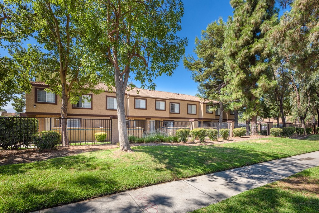 our apartments offer a spacious courtyard with green grass and trees