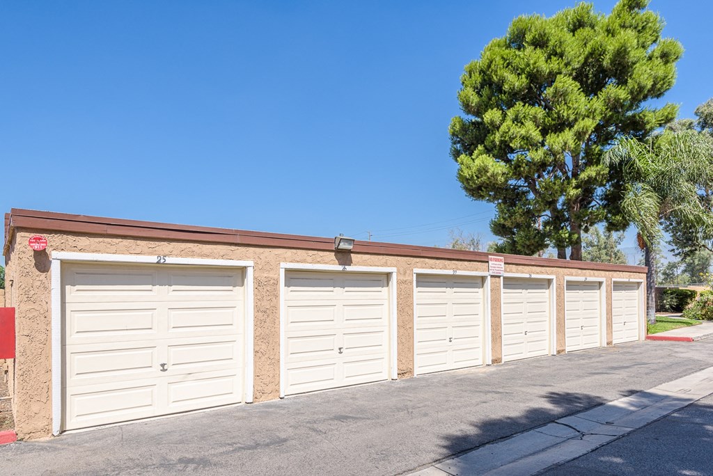 a row of garages at the side of a building