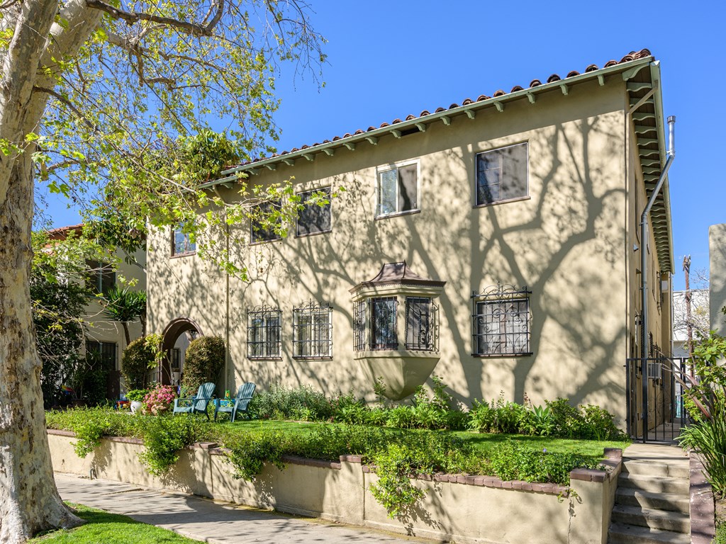 a house with a tree in front of it