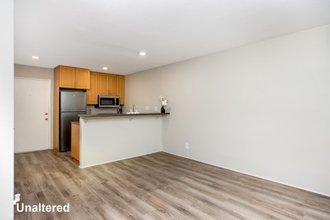 A kitchen with wooden cabinets and a white countertop.