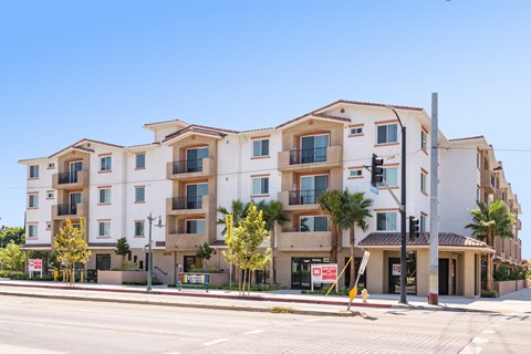 an apartment building on the corner of a street