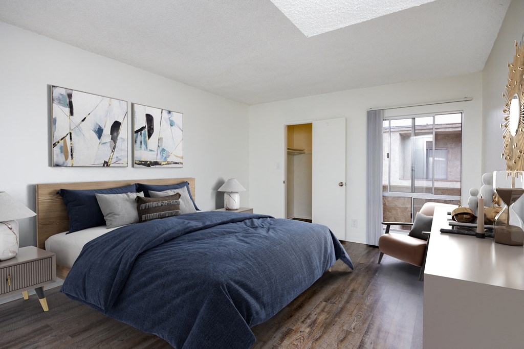 a bedroom with a bed and a desk with a chair