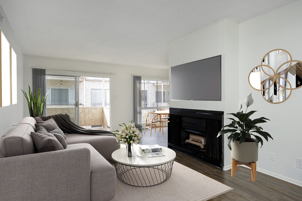 a living room with a couch and a table and a television
