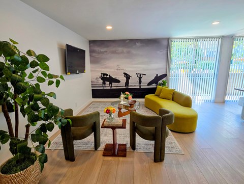 A living room with a surfboard mural on the wall.