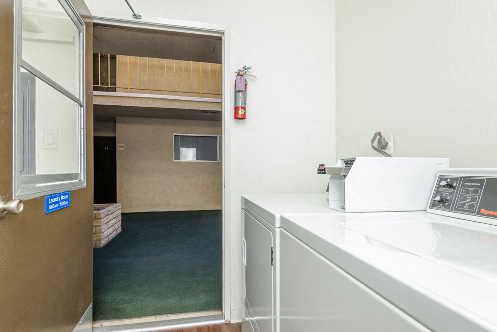 a room with a washer and dryer in it