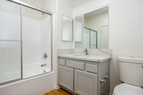 a bathroom with a sink toilet and a shower