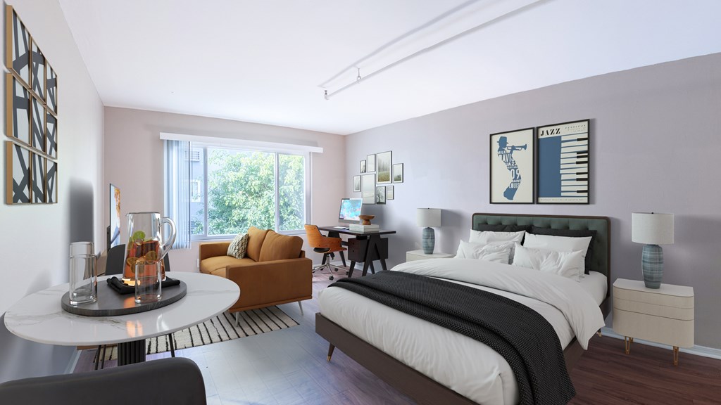 A bedroom with a large bed and a couch.