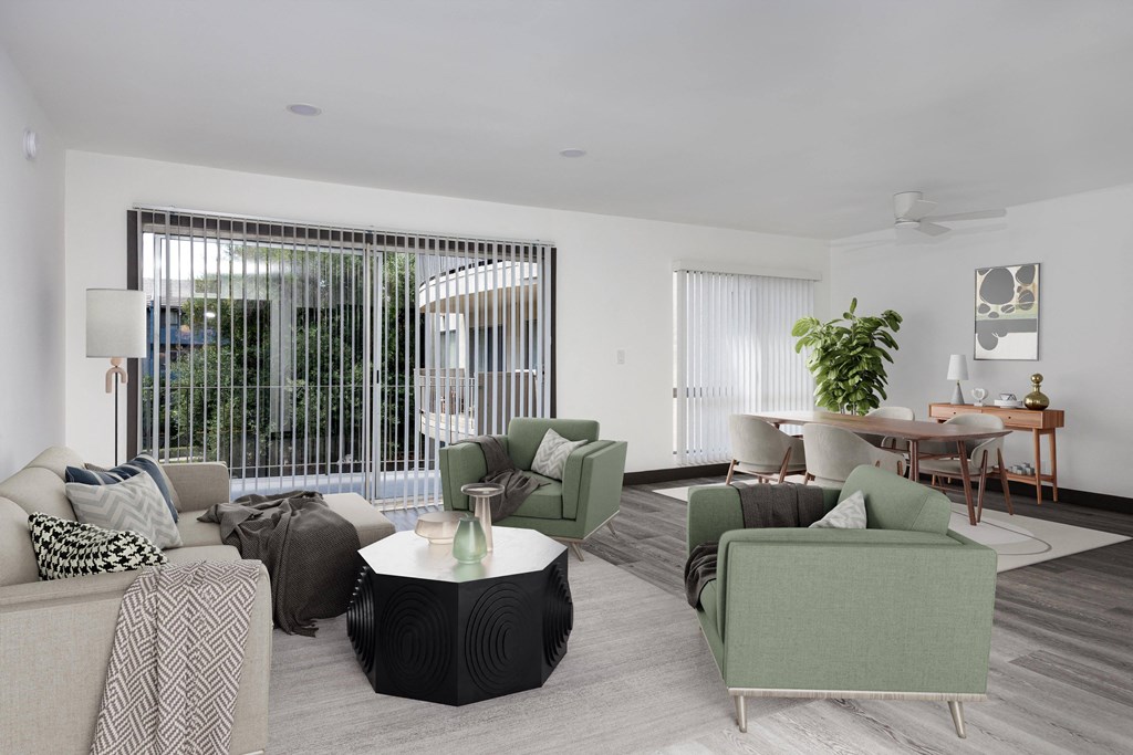 a living room with couches and chairs and a table