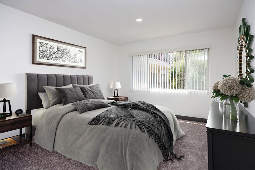 a bedroom with a large bed and a window - Photo Gallery
