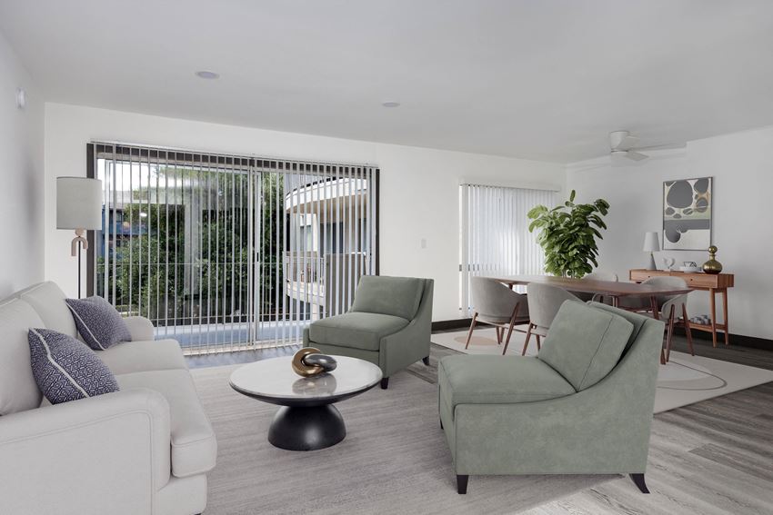 a living room filled with furniture and a large window - Photo Gallery