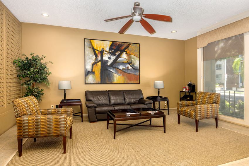 a living room filled with furniture and a ceiling fan - Photo Gallery