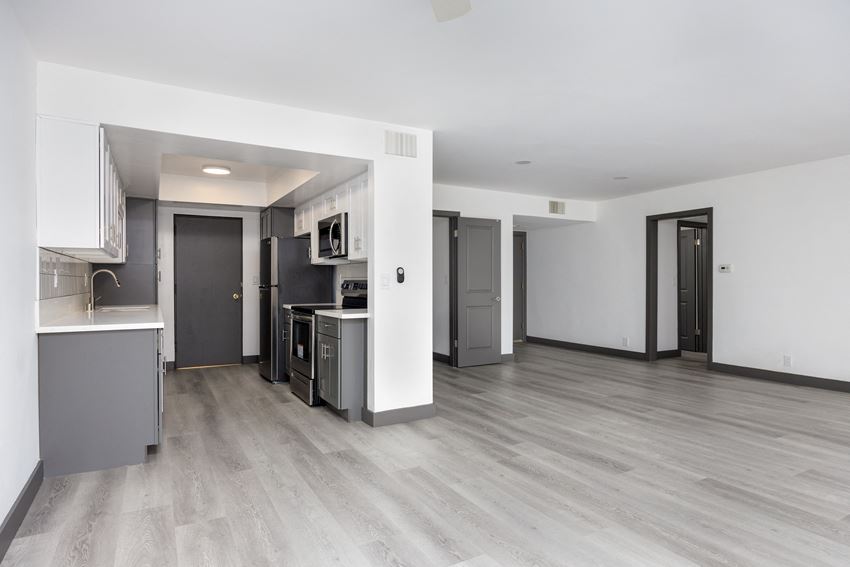 a kitchen and living room in a 555 waverly unit - Photo Gallery
