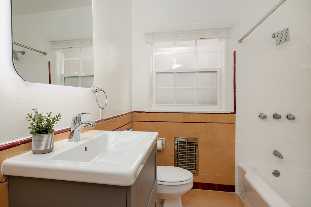 a bathroom with a sink toilet and bathtub