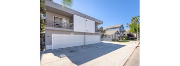 A two-story house with a white garage door.