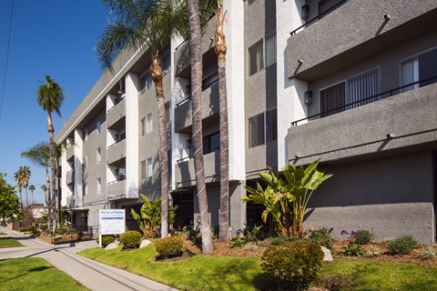 A building with a sign that says "Welcome to the Apartment".