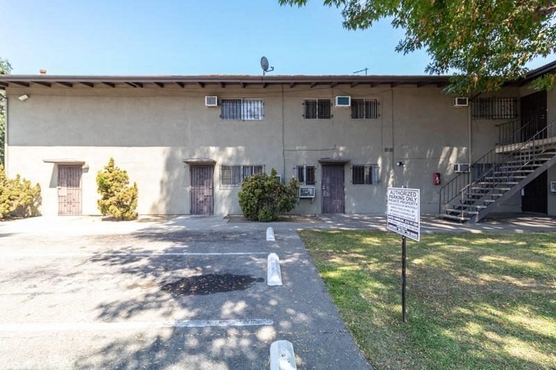 a white building with a sign in front of it