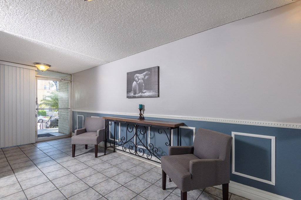 a common area with chairs and a table