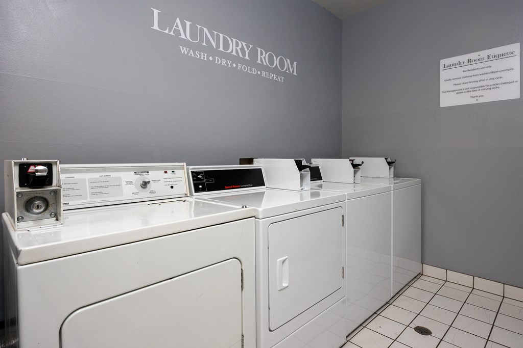 a laundry room with a washer and dryer