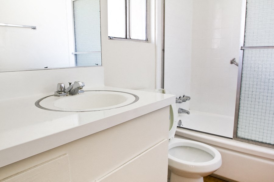 a bathroom with a sink toilet and a shower