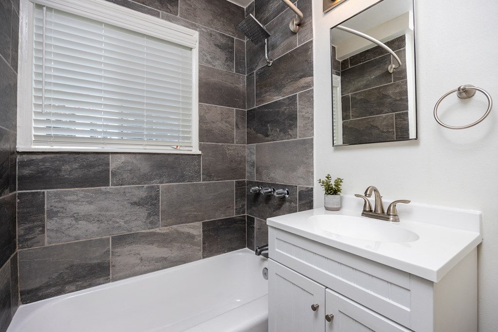 a bathroom with a sink and a bathtub