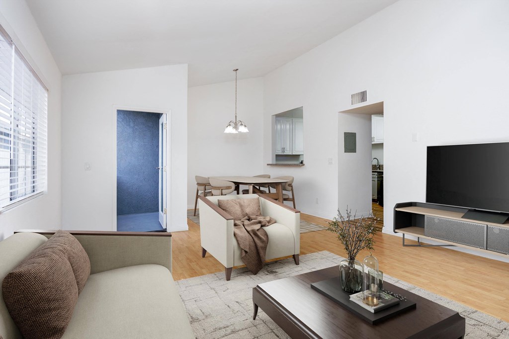 a living room with a couch and a table and a television