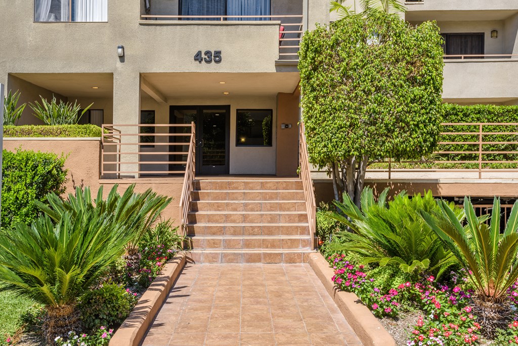 the stairs up to the entrance of an apartment building