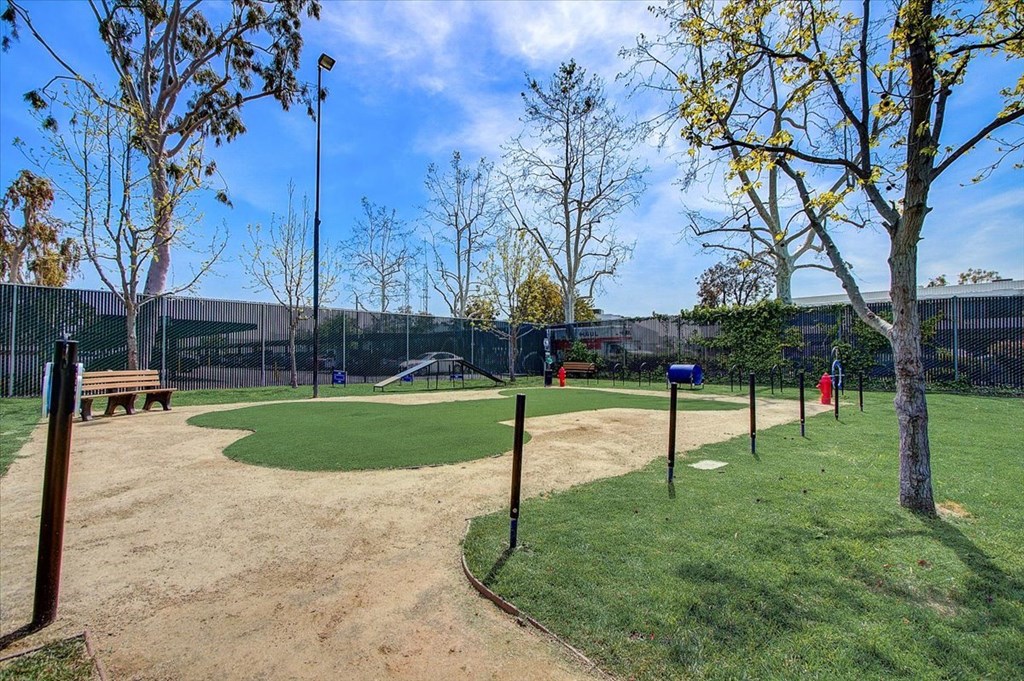 a park with a baseball field and a playground